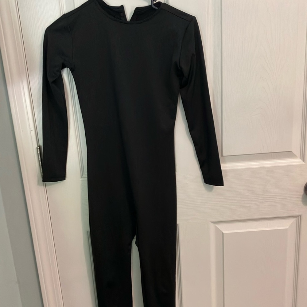 A black bodysuit. The brand is Suprnowa. Size small.